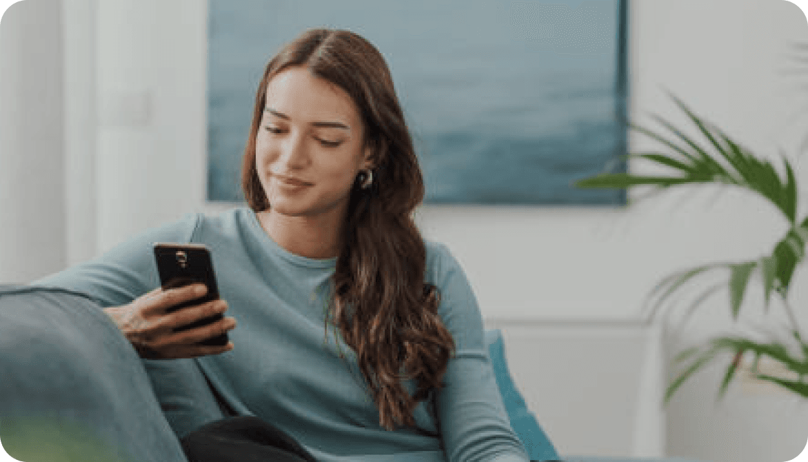 A Credit Angel member checking their improved score on their phone